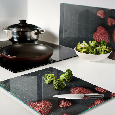 Glazen snijplanken Rode harten op een donkere achtergrond