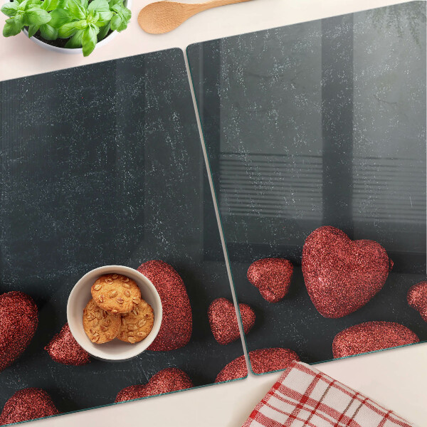 Glazen snijplanken Rode harten op een donkere achtergrond