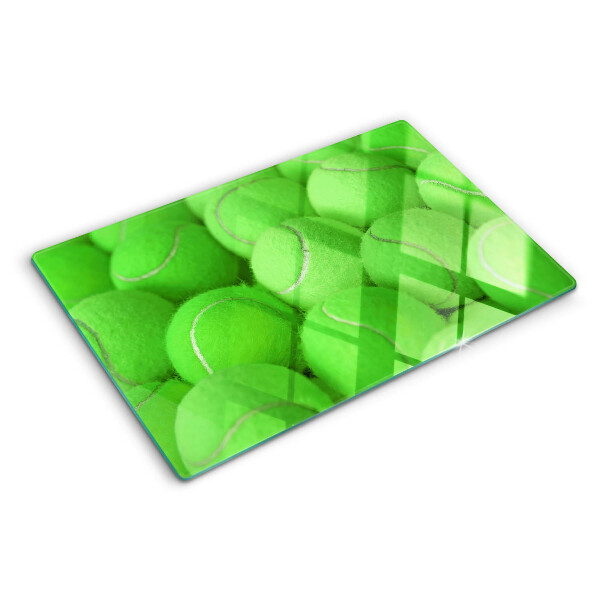 Snijplanken glas Tennisballen op een groene achtergrond