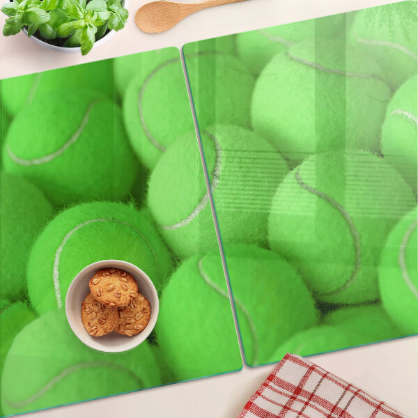 Snijplanken glas Tennisballen op een groene achtergrond