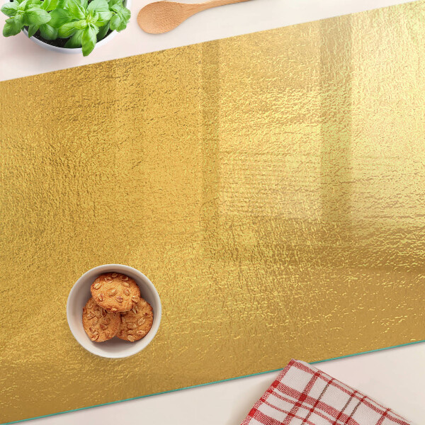 Snijplanken van glas Gouden oppervlak met reflecties