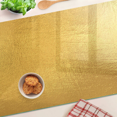 Snijplanken van glas Gouden oppervlak met reflecties