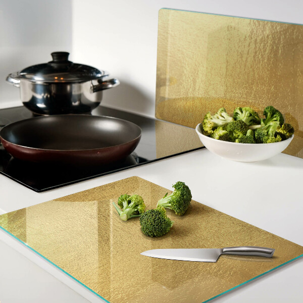 Snijplanken van glas Gouden oppervlak met reflecties