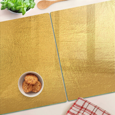 Snijplanken van glas Gouden oppervlak met reflecties