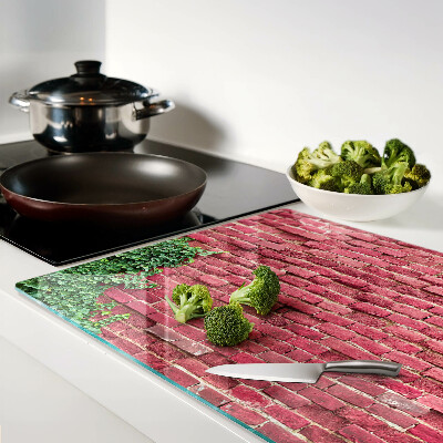 Glazen snijplanken Bakstenen muur met begroeiing