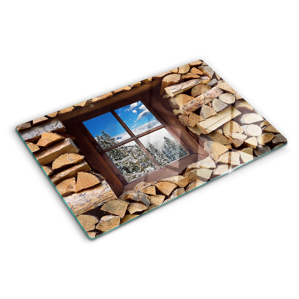 Snijplanken van glas Uitzicht op een winterlandschap door het raam.