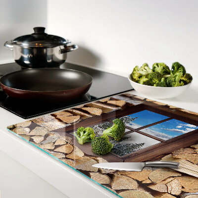 Snijplanken van glas Uitzicht op een winterlandschap door het raam.