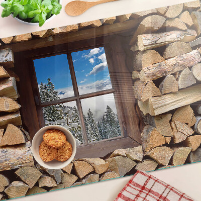 Snijplanken van glas Uitzicht op een winterlandschap door het raam.