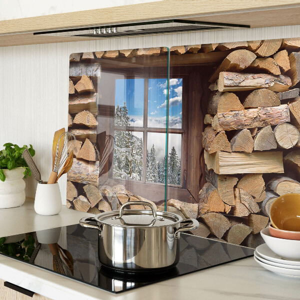 Snijplanken van glas Uitzicht op een winterlandschap door het raam.