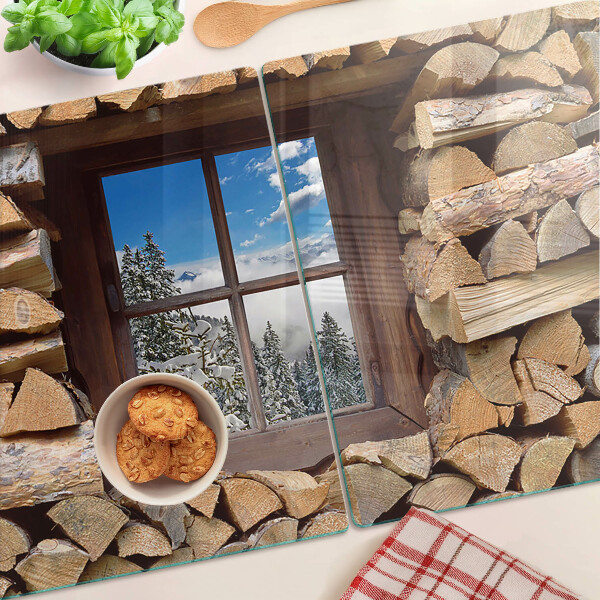 Snijplanken van glas Uitzicht op een winterlandschap door het raam.
