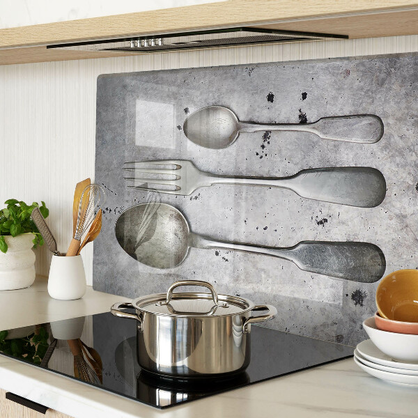 Glazen snijplanken Bestek op een betonnen achtergrond