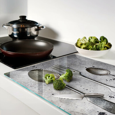 Glazen snijplanken Bestek op een betonnen achtergrond