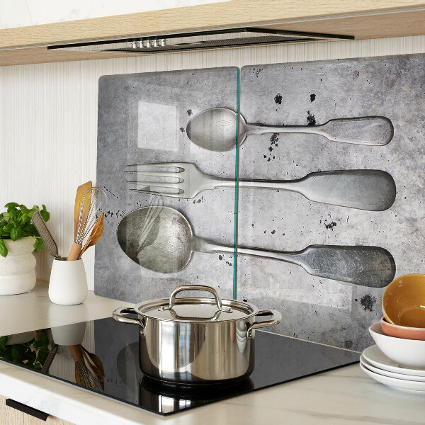 Glazen snijplanken Bestek op een betonnen achtergrond