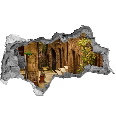 3D sticker gat in stenen muur Een charmante straat in de stad