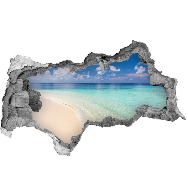 3D sticker gat in stenen muur Een paradijselijk strand met turquoise water.