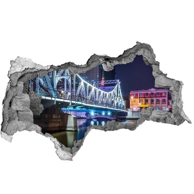 3D sticker gat in stenen muur De brug is 's nachts verlicht.