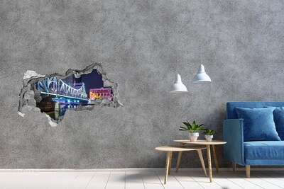 3D sticker gat in stenen muur De brug is 's nachts verlicht.