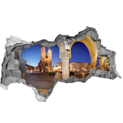 3D muursticker gescheurde muur Het centrale marktplein van Krakau 's nachts