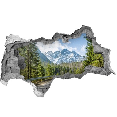 Zelfklevende 3D wandsticker illusie Berglandschap achter het gat in de muur