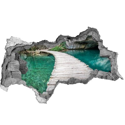 3D sticker gat in stenen muur Mysterieuze brug over turkooizen water