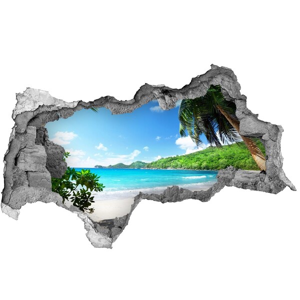 Wandsticker 3D doorkijk Caribisch strand door een gat in de muur