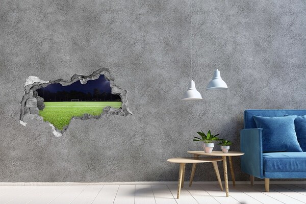 3D sticker gat in stenen muur Voetbalveld 's nachts