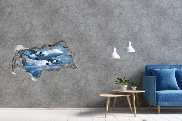 3D sticker gat in stenen muur Aankomst van een vliegtuig in de wolken