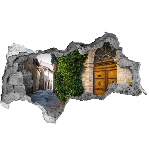 3D sticker gat in stenen muur Een charmant steegje in de stad