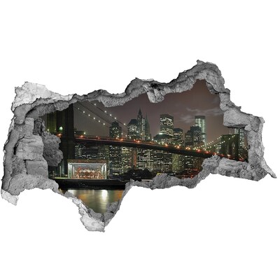 Wandsticker 3D doorkijk New York 's nachts, gezien door een gat in de muur.