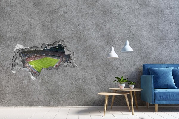 3D sticker gat in stenen muur Het voetbalstadion in actie.