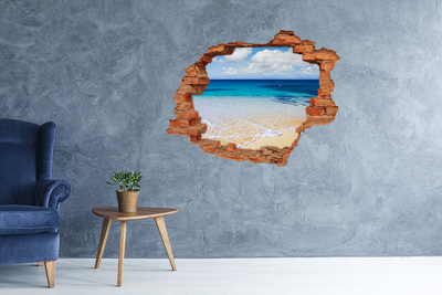 Vinyl muursticker 3D breekeffect Caribisch strand door een gat in de muur