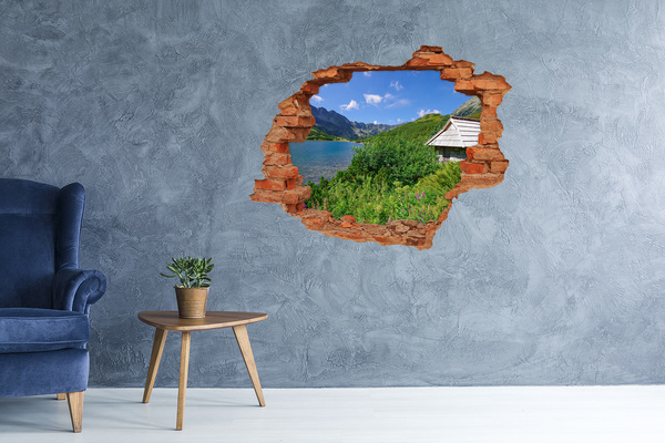 Grote 3D muursticker gat in de muur Berglandschap met een meer