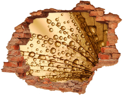 Vinyl muursticker 3D breekeffect Een gouden druppel op een betonnen achtergrond