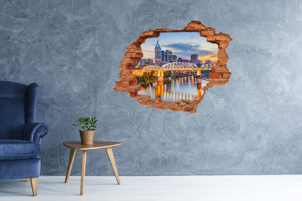Grote 3D muursticker gat in de muur Een brug over een rivier in de stad