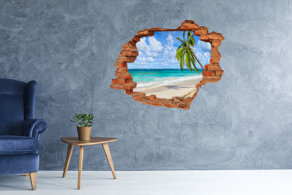 Vinyl muursticker 3D breekeffect Caribisch strand door een gat in de muur