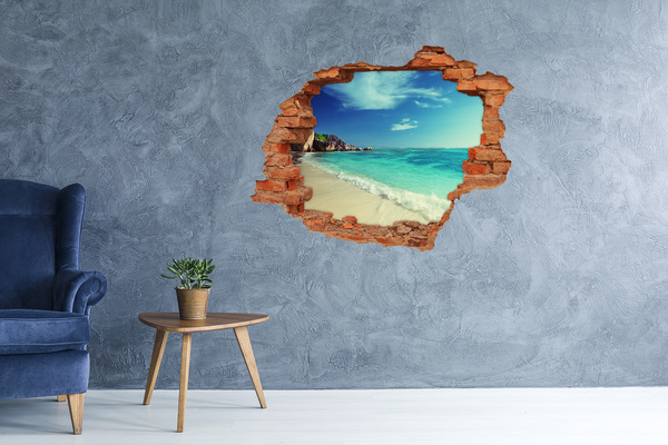 Vinyl muursticker 3D breekeffect Caribisch strand door een gat in de muur