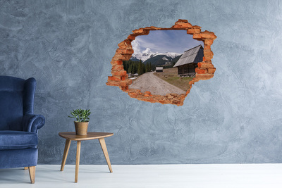 Grote 3D muursticker gat in de muur Berglandschap met hutten