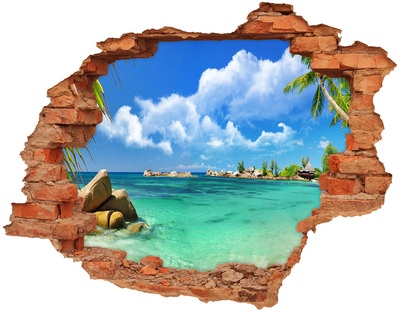 Grote 3D muursticker gat in de muur Een paradijselijk strand met turquoise water.
