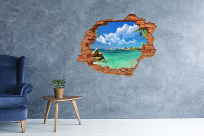 Grote 3D muursticker gat in de muur Een paradijselijk strand met turquoise water.