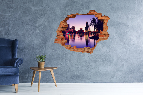 Vinyl muursticker 3D breekeffect Zonsondergang boven de stad