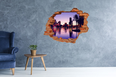 Vinyl muursticker 3D breekeffect Zonsondergang boven de stad