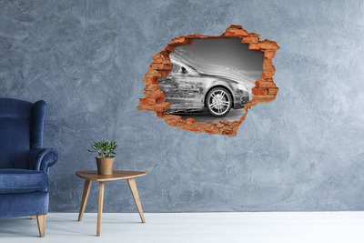Vinyl muursticker 3D breekeffect Een auto rijdt dwars door een muur.