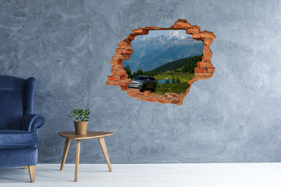 Grote 3D muursticker gat in de muur Berglandschap met een meer