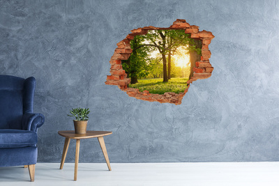 Grote 3D muursticker gat in de muur Een groen paradijs tussen de bomen.