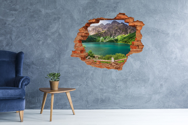 Vinyl muursticker 3D breekeffect Berglandschap door een gat in de muur