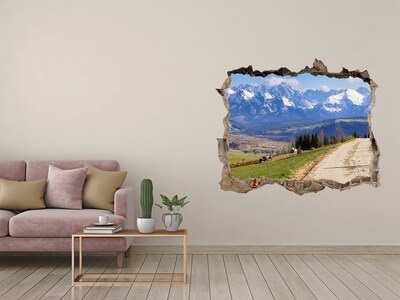 Wandsticker 3D gat met uitzicht Berglandschap achter het gat in de muur