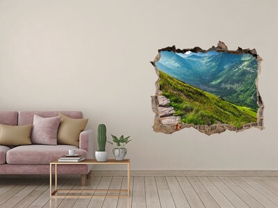 Wandsticker 3D doorkijk Berglandschap achter het gat in de muur