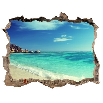 Wandsticker 3D doorkijk Caribisch strand door een gat in de muur