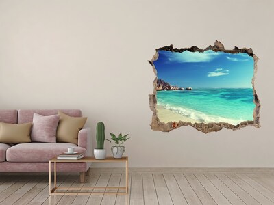 Wandsticker 3D doorkijk Caribisch strand door een gat in de muur