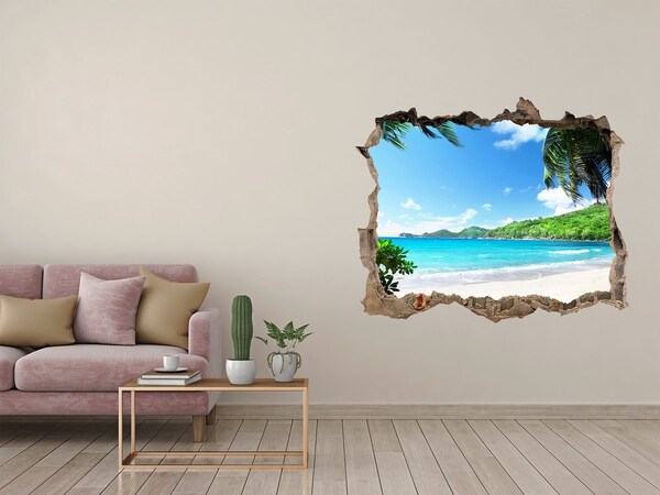 Zelfklevende 3D wandsticker illusie Caribisch strand door een gat in de muur